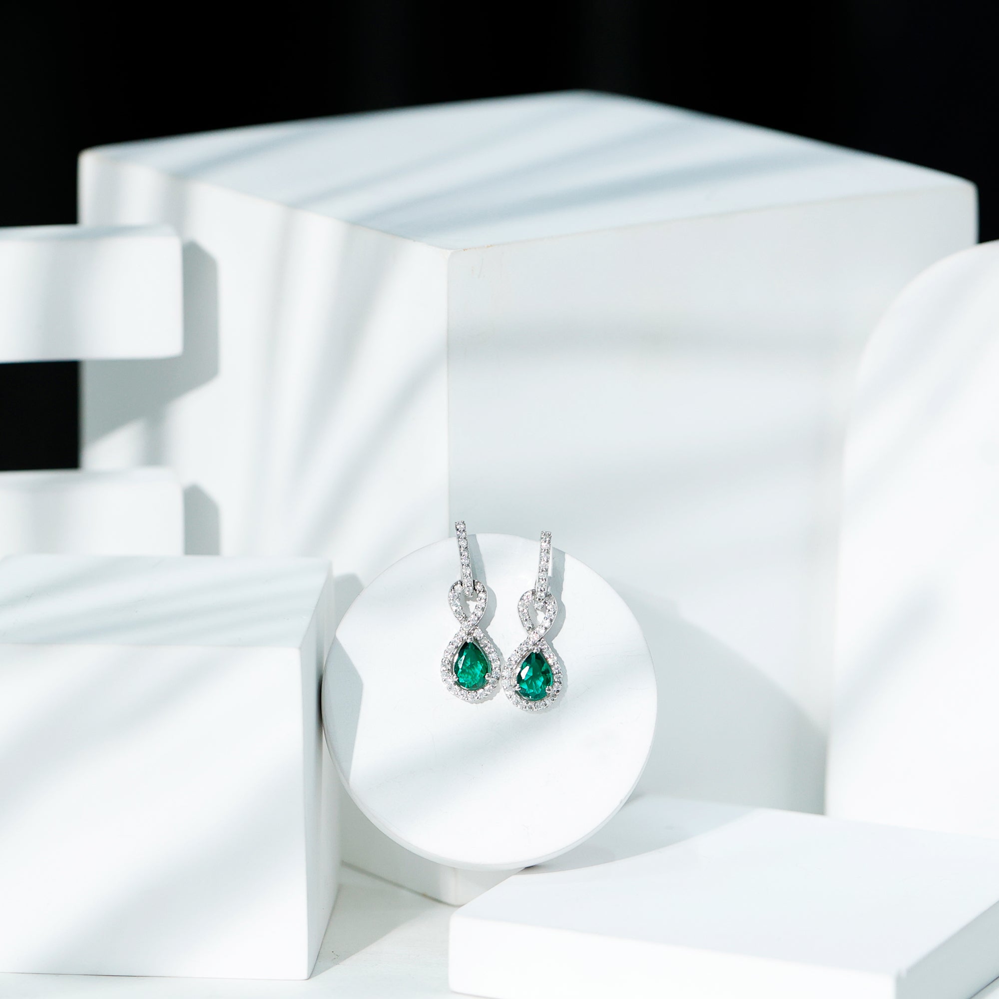 Lab Created Emerald Infinity Drop Earrings with Moissanite