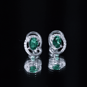 Oval Shaped 5X7 MM Lab Grown Emerald Designer Stud Earrings