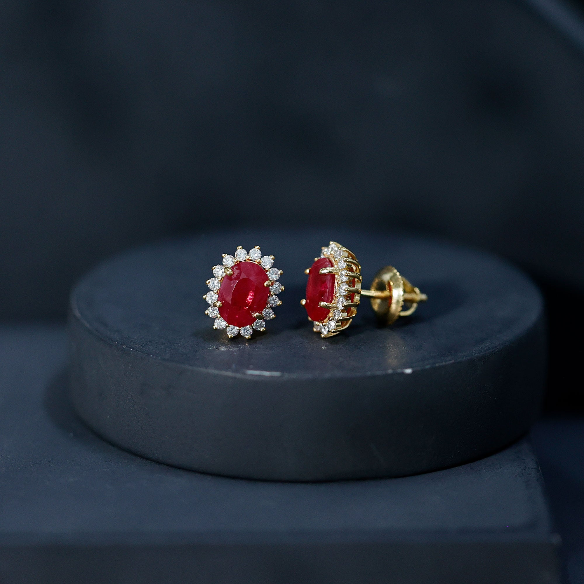 Natural 5X7 mm Oval Ruby Stud Earrings With Diamond Halo