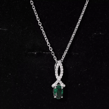 Oval Lab Created Emerald Infinity Pendant with Moissanite in Silver