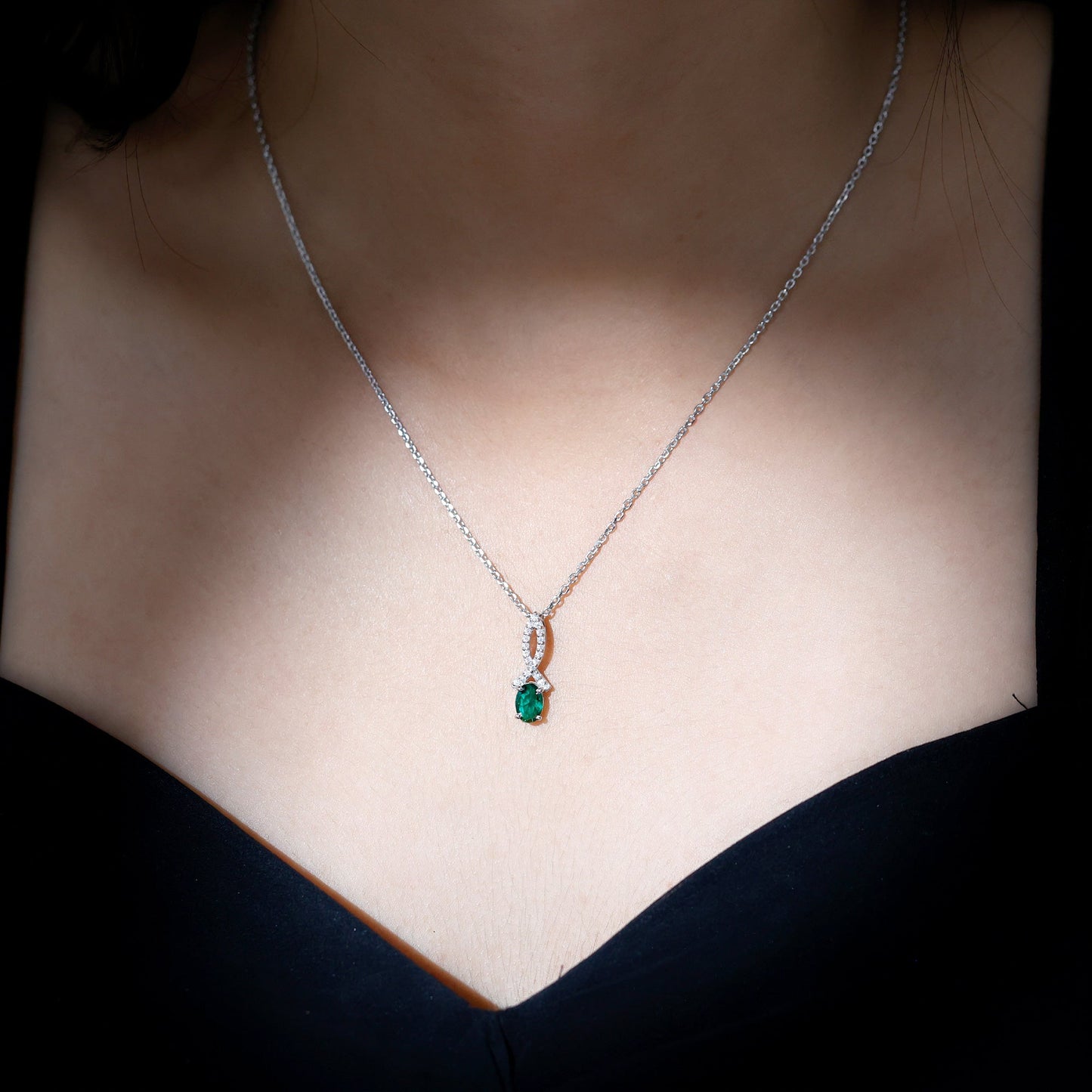 Oval Lab Created Emerald Infinity Pendant with Moissanite in Silver