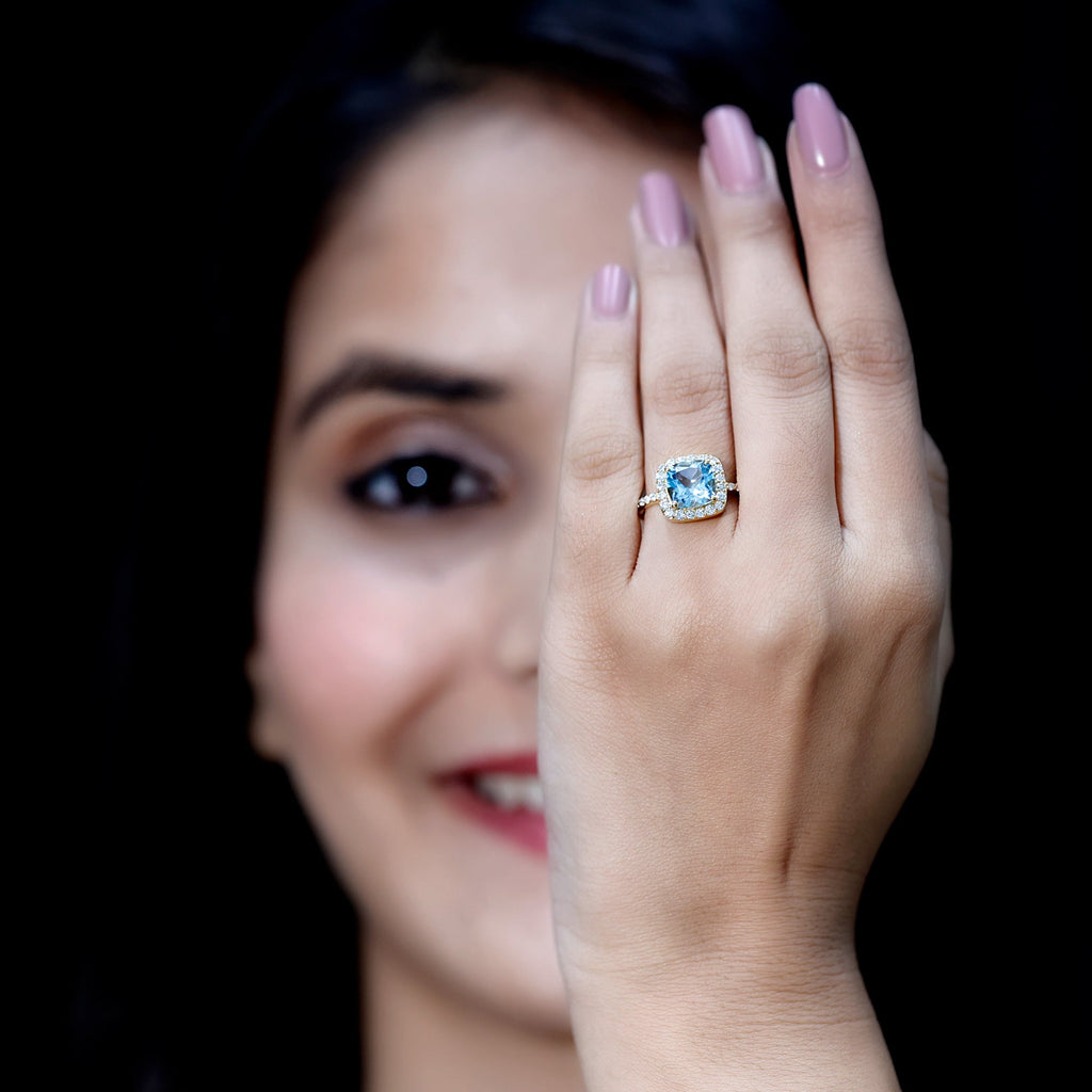 Cushion Cut Sky Blue Topaz and Diamond Halo Engagement Ring