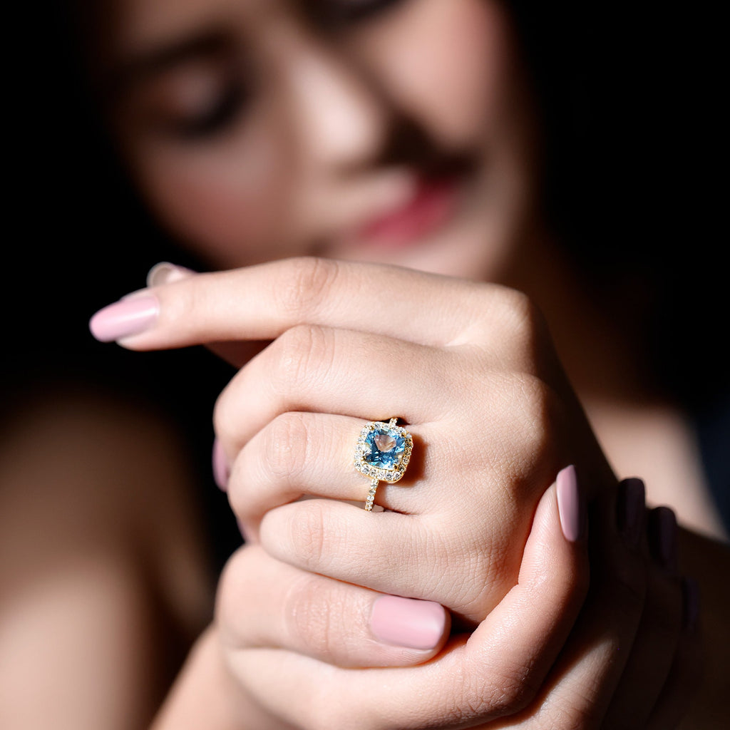 Cushion Cut Sky Blue Topaz and Diamond Halo Engagement Ring